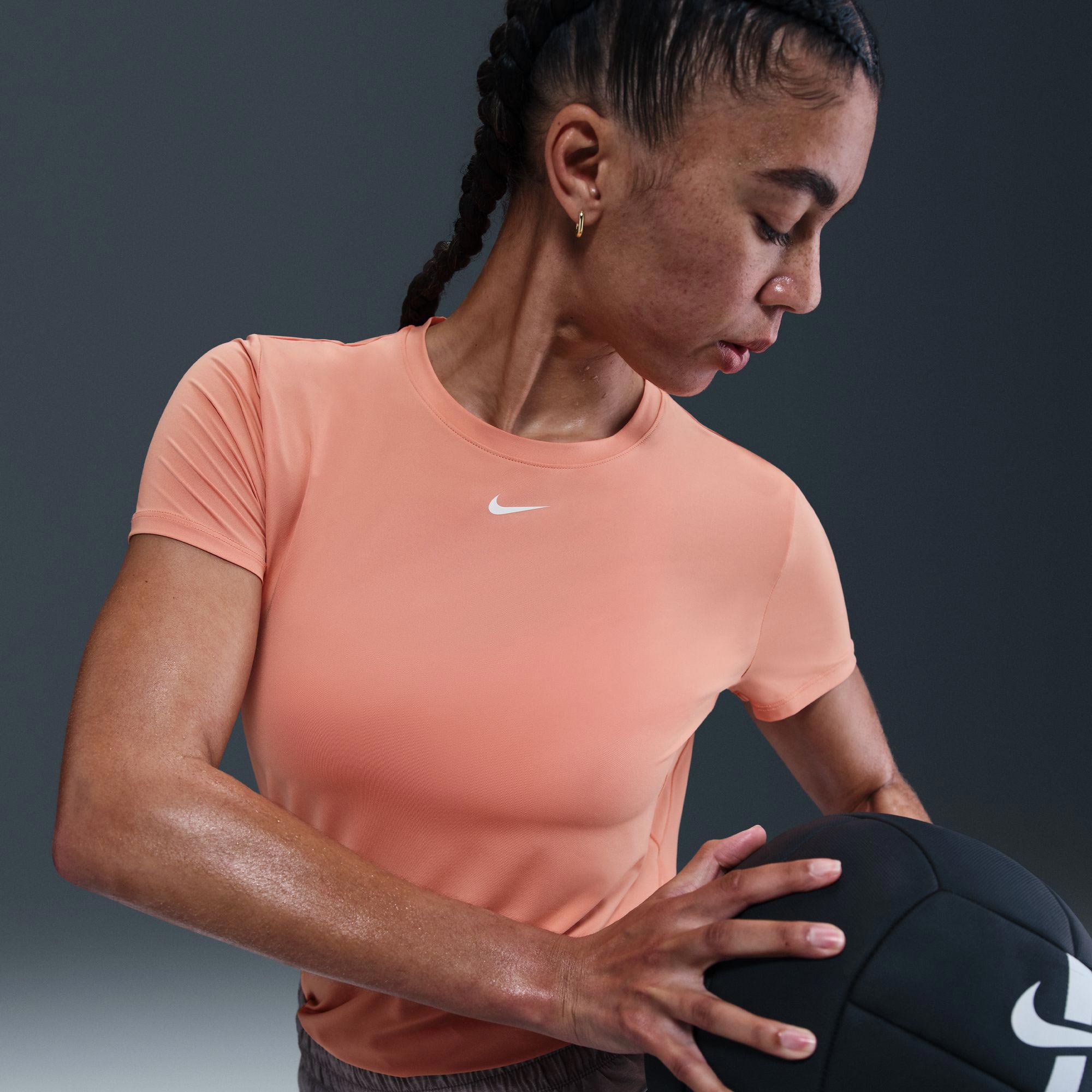 coral color nike shirt