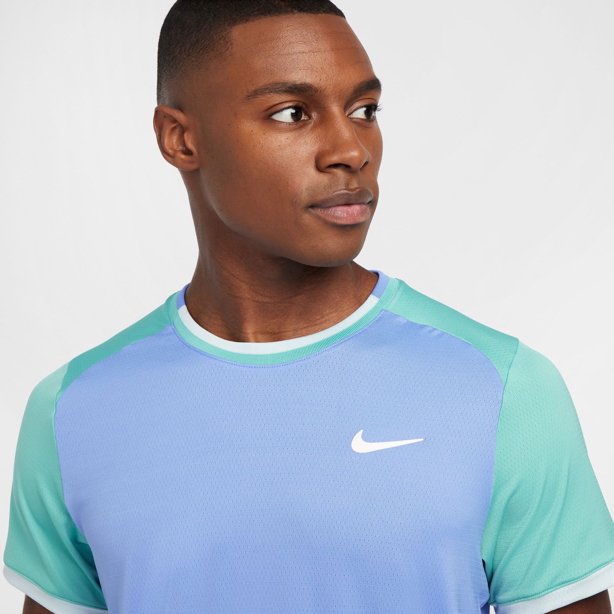 green and blue nike shirt